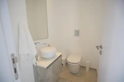 a white bathroom with a sink and a toilet at Protaras Almaria Villa ALM03 in Protaras