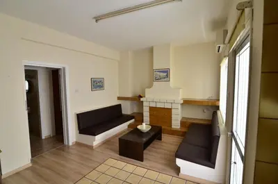 a living room with a couch and a table at Central, renovated, fully equipped, spacious 3BD in Strovolos