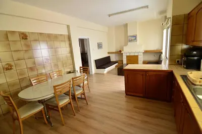 a kitchen and dining room with a table and chairs at Central, renovated, fully equipped, spacious 3BD in Strovolos