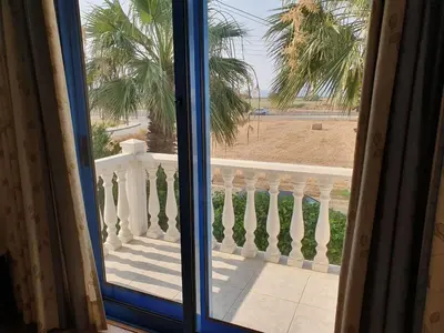 a view of the beach from a window at De Angelo Villa in Pyla