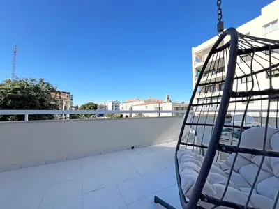 a swing on the roof of a building at Albert's Apartment Center 101K in Larnaka