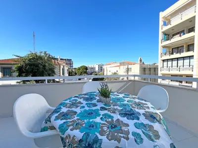 a table and chairs on a balcony with a table at Albert's Apartment Center 101K in Larnaka