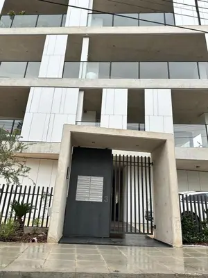 a building with a black door in front of it at Lux Hub Spot-Νear European Uni Engomi in Nicosia
