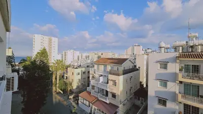 an aerial view of a city with buildings at STAY Amphora Apartment in Larnaka