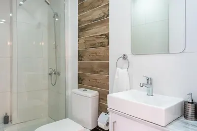 a bathroom with a toilet and a sink and a shower at Luna - Homely Studio W Balcony in Larnaca in Larnaka