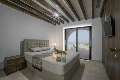 a bedroom with a large bed and a large window at Sunrise Dream Villa-Protaras in Protaras