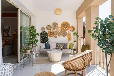 a living room with a couch and chairs on a porch at Sundrop - 1-Bedroom Apt W Terrace in Larnaca in Larnaka