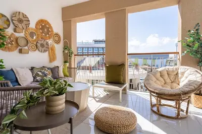 a living room with a couch and a table at Sundrop - 1-Bedroom Apt W Terrace in Larnaca in Larnaka