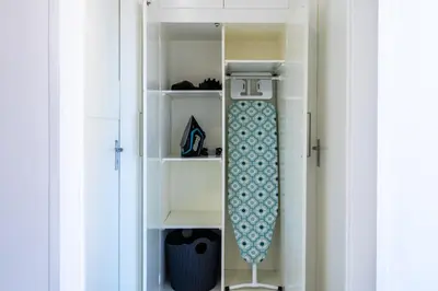 a white book shelf with a skateboard in it at Vibe - 1 Bedroom Apartment W Balcony in Larnaca in Larnaka