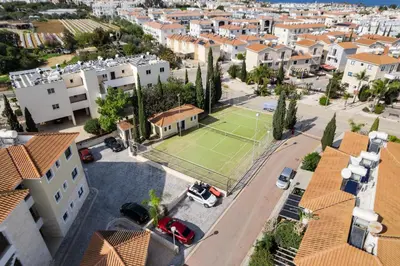 an aerial view of a city with a tennis court at Apartment Sun 'n Joy in Paralimni