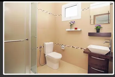 a bathroom with a toilet and a sink and a shower at Sunshine Villa Private Pool Luxury Garden 2' walk to Kalamies beach Pernera in Protaras