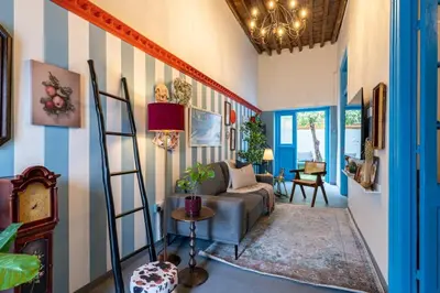 a living room with a striped wall at Blue Haven - 2-BR Artistic Escape in Larnaca in Larnaka