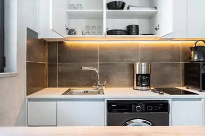 a kitchen with a sink and a dishwasher at Dusk - Harmonic Studio by Plus 49 in Mackenzie in Larnaka