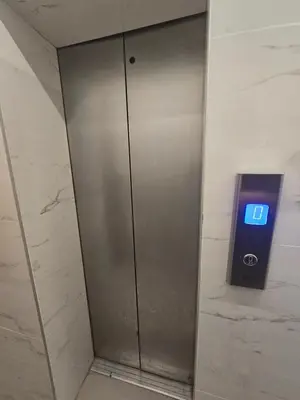 an elevator in a building with a sign on it at two-room apartment center in Limassol