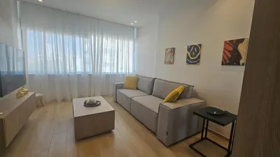 a living room with a couch and a table at STAY City Center Gem in Nicosia