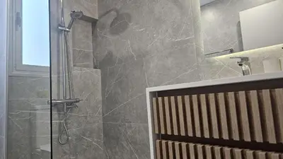 a shower with a glass door in a bathroom at STAY City Center Gem in Nicosia
