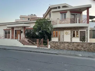 a house on the side of a street at Plumeria Place Bright and spacious studio in Larnaka