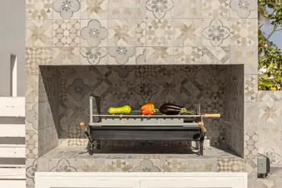 a fireplace with vegetables on top of it at Protaras Villa Cemelia in Protaras
