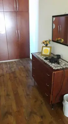 a room with a dresser with a mirror on top of it at Elenas Home in Limassol