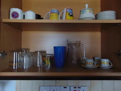 a shelf with cups and other items on it at Elenas Home in Limassol