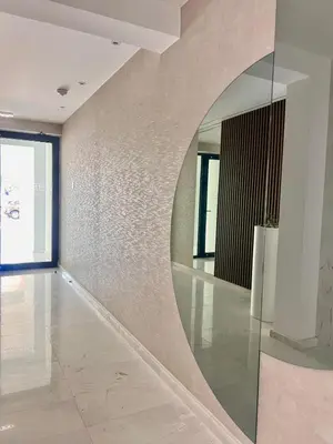 a hallway with a large mirror on the wall at Mackenzie Seaside Apartment in Larnaka