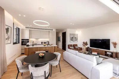 a living room with a couch and a table at Elysium Heights in Nicosia