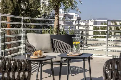 a couple of tables and chairs on a patio at Elysium Heights in Nicosia