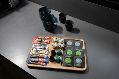 a tray with watches and other items on a table at Urban Condo 33 with Balcony - 2 Bdr in Nicosia