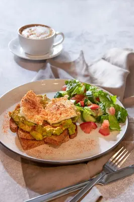 a plate with a sandwich and a salad and a cup of coffee at Urban Condo 33 with Balcony - 2 Bdr in Nicosia