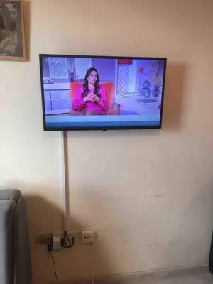 a flat screen tv hanging on a wall at Lovely Paradise - 1-bd apt in Kapparis - Protaras in Paralimni