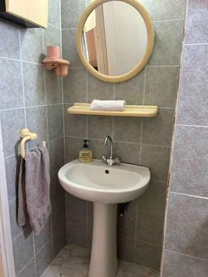 a bathroom with a sink and a mirror at Lovely Paradise - 1-bd apt in Kapparis - Protaras in Paralimni