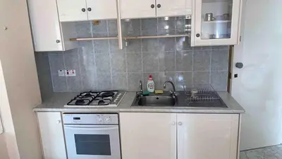 a kitchen with a sink and a stove at Lovely Paradise - 1-bd apt in Kapparis - Protaras in Paralimni