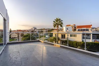 a large balcony with a view of a city at Penthouse Great View Hydromassage Penthouse hottub in Limassol