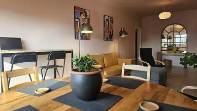 a living room with a table with a plant on it at STAY Velvet Apartment in Limassol