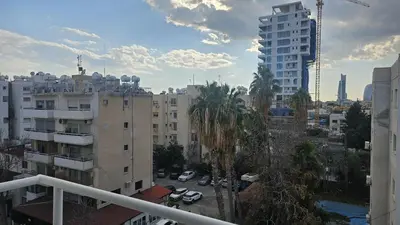 a view of a city with buildings and palm trees at STAY Velvet Apartment in Limassol