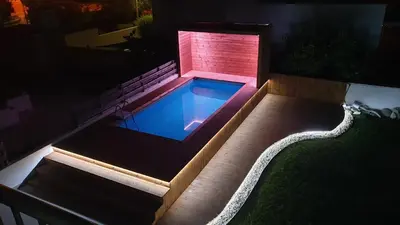 a swimming pool in a backyard at night at Perle Di Gio in Larnaka