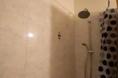 a bathroom with a shower with a shower curtain at Central & Peaceful Nicosia 2BR in Nicosia