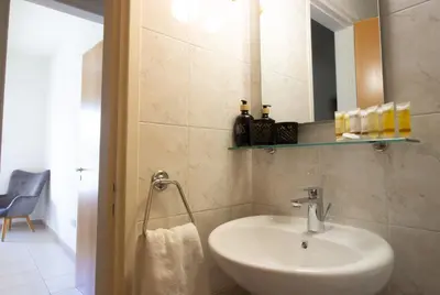 a bathroom with a sink and a mirror at Central & Peaceful Nicosia 2BR in Nicosia