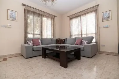 a living room with a couch and a coffee table at Malama 28 Villa Ekaterina in Paralimni