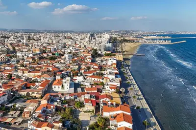 an aerial view of a city next to the ocean at Lito - Slow Living in Larnaka