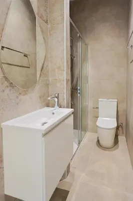 a bathroom with a toilet and a sink and a mirror at Lito - Slow Living in Larnaka