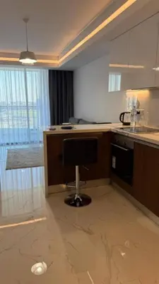 a kitchen with a desk with a computer in it at Luxury Apartments with Sea View and Mountain View in Grand Sapphire Resort in Iskele