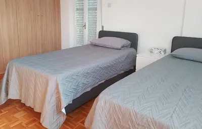 two beds sitting next to each other in a bedroom at alfarome60 in Nicosia