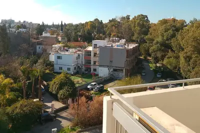 an aerial view of a city with trees and buildings at alfarome60 in Nicosia
