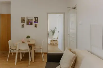 a living room with a table and a couch at Stylish Stonehouse in Platres in Platres
