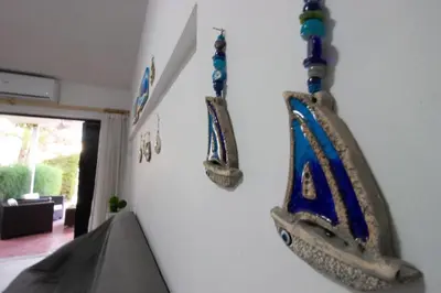 a wall with a boat decorations on it at Large Veranda 2BR Walk to Beach in Paralimni