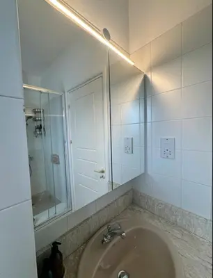 a bathroom with a sink and a mirror at SWeET LEMON VILLA in Protaras
