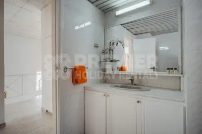 a bathroom with a sink and a mirror at Villa Andreas in Protaras