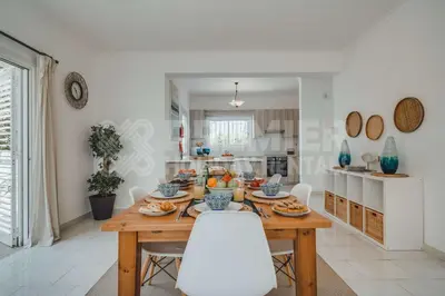 a kitchen and dining room with a table and chairs at Villa Andreas in Protaras