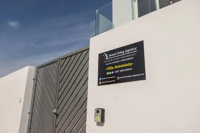 a sign on the side of a building at Villa Antonieta in Ayia Napa